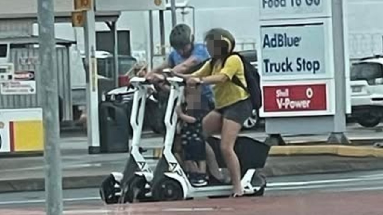 A couple on e-scooters spotted on Draper St Portsmith with young children without helmets on board. Picture: Jessica Nelson