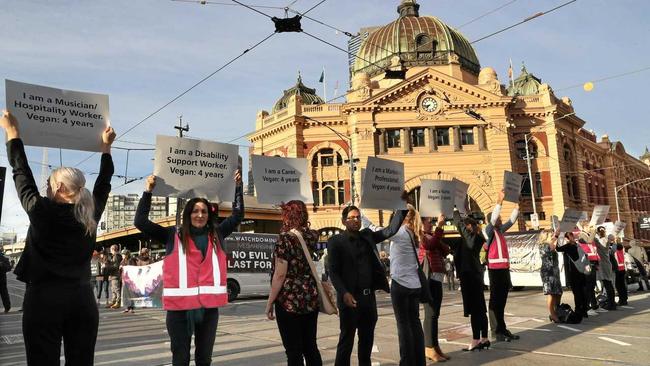 Animal rights protesters block the intersections of Flinders and Swanston Street during early morning traffic in Melbourne, Monday, April 8, 2019. Animal rights protesters are blocking a CBD intersection while south east of Melbourne, others have chained themselves to a truck. (AAP Image/David Crosling) NO ARCHIVING. Picture: DAVID CROSLING