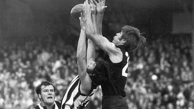 Carlton footballer Geoff Southby jumps over Collingwood’s Robert Dean to mark the ball. Southby is a great at the Blues. Picture: Herald Sun.