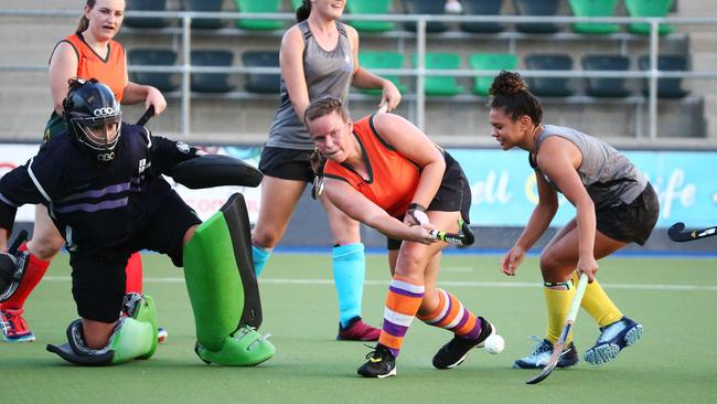 Kayla Devlin sweeps the ball away from goal in the Cairns Hockey pre season match between the Cairns All Stars and the Cairns Young Guns. PICTURE: BRENDAN RADKE