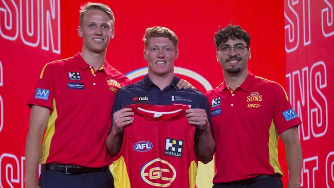 SA exports Jack Lukosius (left) and Izak Rankine (right) welcome Matt Rowell to the Suns. Picture: Michael Klein