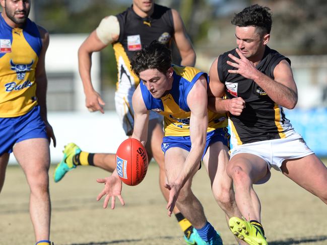 Eastern Football League: Noble Park v Balwyn at Pat Wright oval, Noble Park. The Bulls stormed home in the final quarter to end the season with a victory.  Noble Park #7 Luke Nelson wins the ball and rides the bump. Picture: AAP/ Chris Eastman