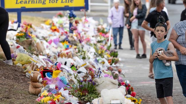 SUNDAY Pictures. Mourners pay tribute to the children who died after gust of wind swept away a jumping castle at Hillcrest Primary School Devonport Tasmania. Picture: Jason Edwards