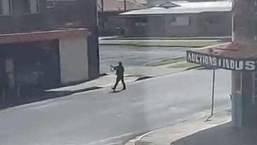 The active gunman is seen firing shots on a busy street in Windang. Picture: Supplied