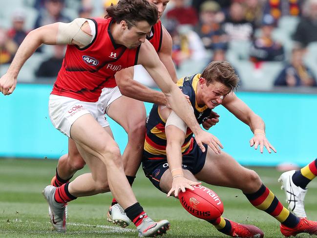 Essendon's Andrew McGrath looks to stop Matt Crouch Picture: Sarah Reed