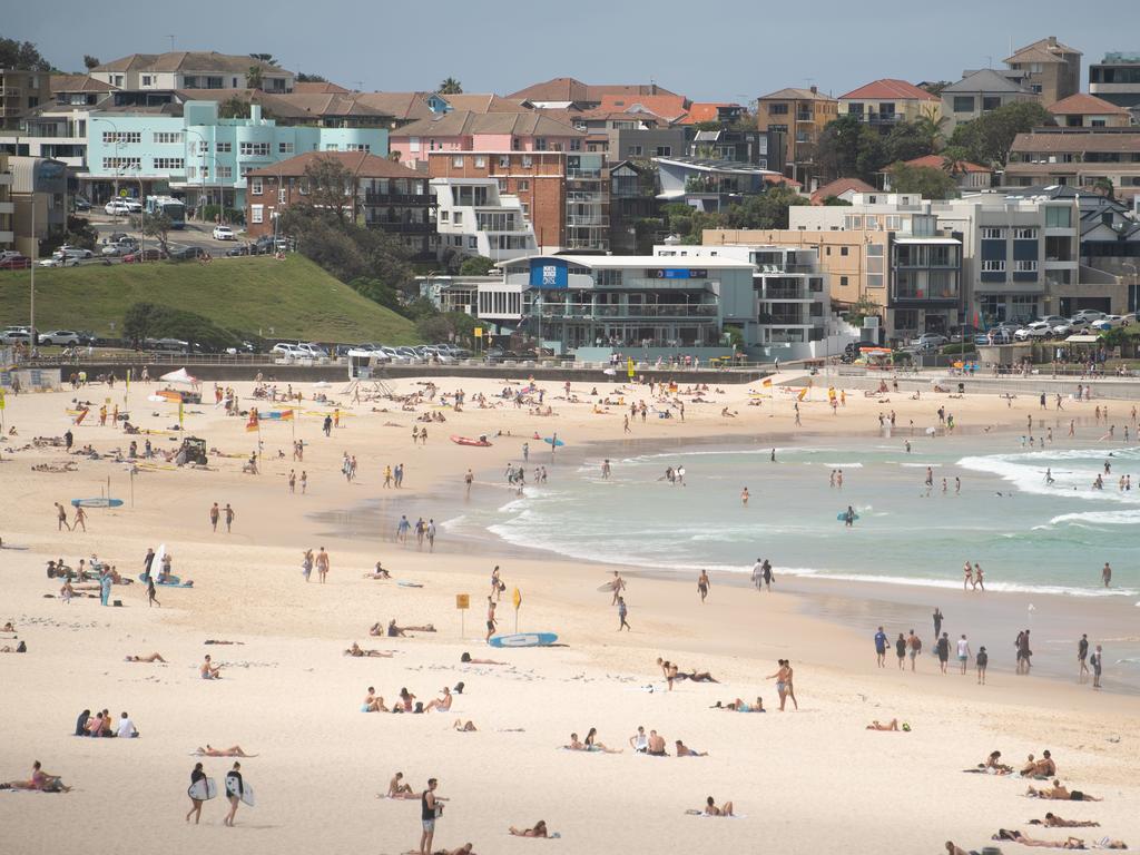 Despite COVID-19 restrictions, many hit Sydney’s Bondi in March leading to its closure. Picture: AAP Image/James Gourley