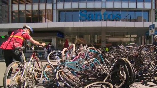 Extinction Rebellion protesters piled up bicycles outside the Santos building in the middle of the road. Picture: 9 News