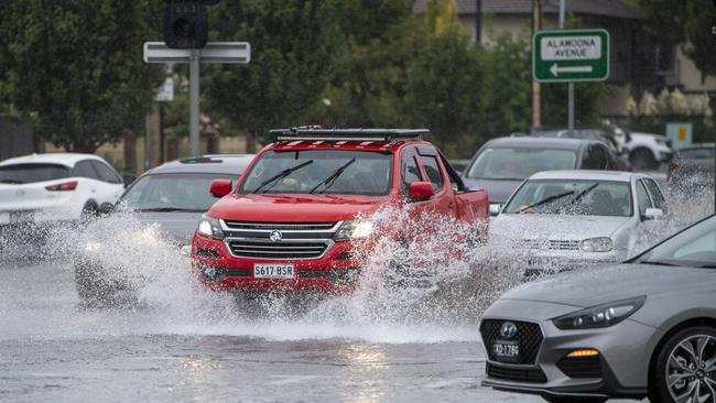 Traffic on Marion Rd battle flooding near the Finnis St intersection. Picture: Mark Brake