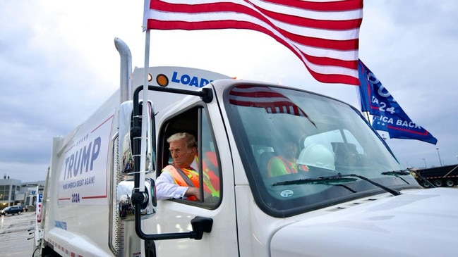 Ironic performance art … Donald Trump holds a press conference from inside a rubbish truck at Green Bay, Wisconsin. Picture: X