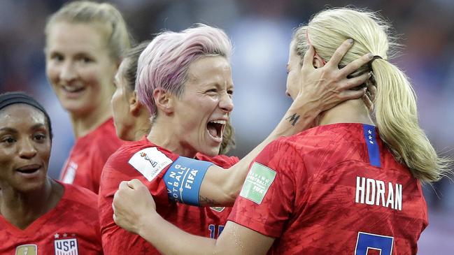 Lindsey Horan, right, celebrates with Megan Rapinoe during the US team’s thumping of Thailand. Picture: AP