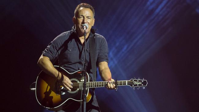 (FILES) This file photo taken on September 30, 2017 shows Bruce Springsteen performing during the closing ceremony of the Invictus Games 2017 at Air Canada Centre in Toronto, Canada.  Bruce Springsteen on November 28, 2017, announced four more months of intimate concerts on Broadway after his initial run triggered massive interest -- and wide disappointment among fans who couldn't get tickets. The rock legend, who for decades has sold out arenas with his adrenaline-fueled marathon performances, said he would extend his residency at the 960-seat Walter Kerr Theatre from February 28 to June 30. / AFP PHOTO / Geoff Robins