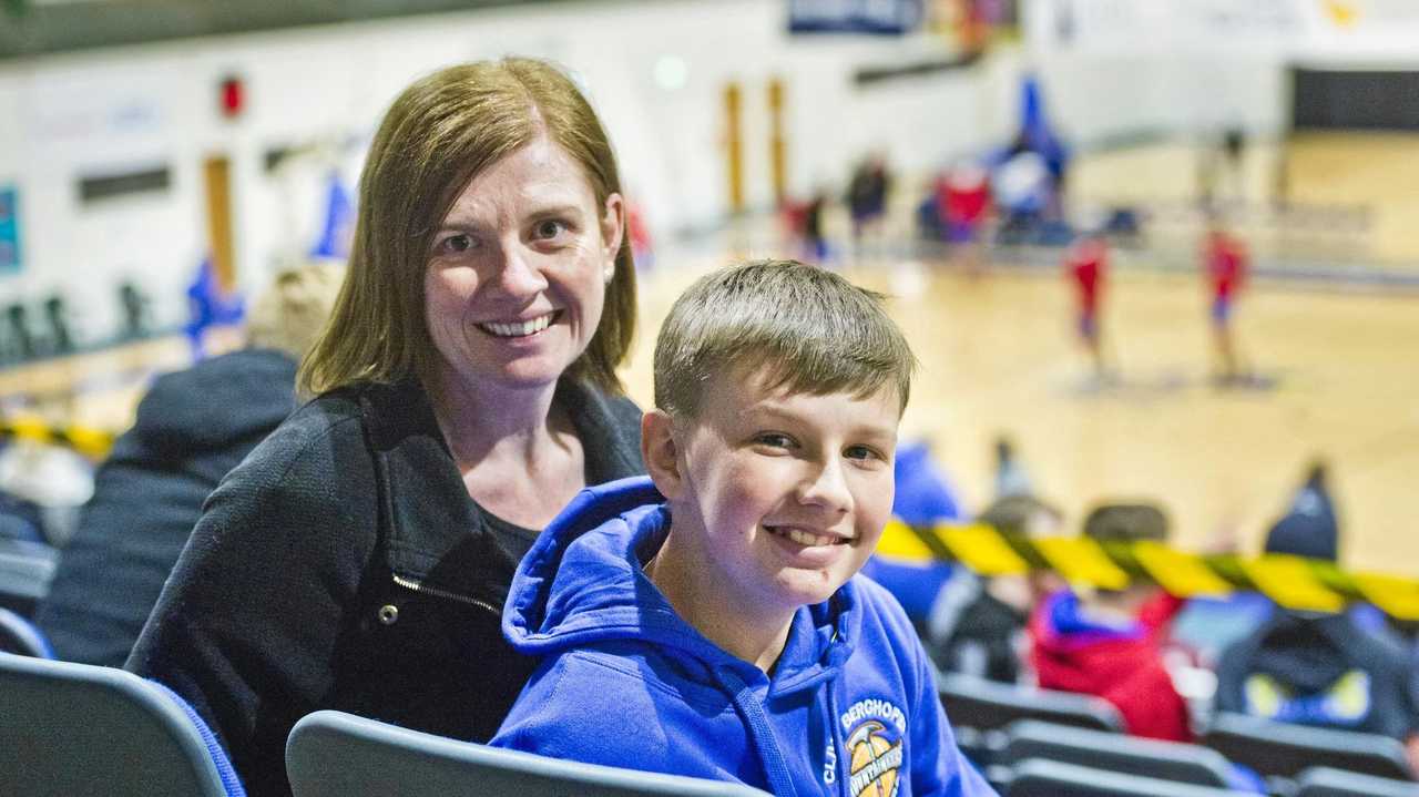 SPECIAL HONOUR: Jake Wisley and his mother Wendy Moss are regulars at the Toowoomba Mountaineers home games. The QBL side recently presented Jake with a signed jersey acknowledging his support and passion. Picture: Nev Madsen