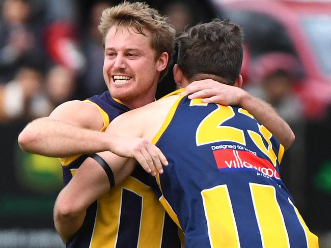 Kayne Murphy (left) of Rubertswood reacts after kicking a goal during the RDFL grand final, Sunbury, Sunday, September 15, 2019. RDFL footy grand final: Rupertswood v Wallan. (AAP Image/James Ross) NO ARCHIVING