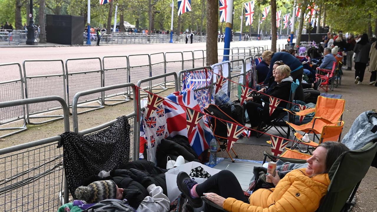 The Mall, UK: Members of the public camp out as Police officers patrol at The Mall near Buckingham Palace on September 18, 2022, ahead of Queen Elizabeth II‘s funeral on September 19. Picture: AFP