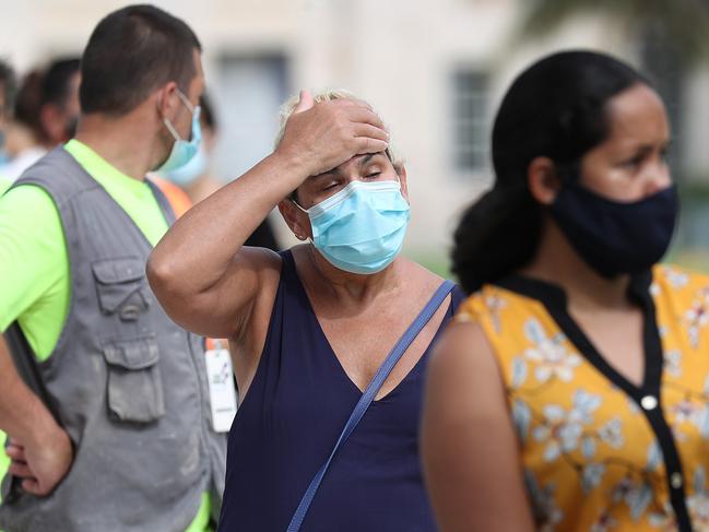 MIAMI BEACH, FLORIDA - JULY 17: Carmen Garcia stands in line to be tested for COVID-19 at an Aardvark Mobile Healths Mobile Covid-19 Testing Truck on July 17, 2020 in Miami Beach, Florida. The Aardvark mobile units were brought to the streets of Miami Beach through the Florida Department of Emergency Management as the cases of coronavirus spikes in the State of Florida.   Joe Raedle/Getty Images/AFP == FOR NEWSPAPERS, INTERNET, TELCOS & TELEVISION USE ONLY ==