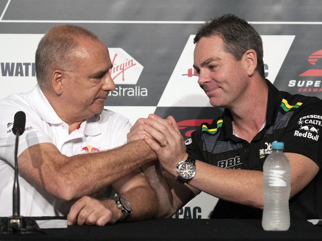 Lowndes (right) and Triple Eight Race Engineering team boss Roland Dane. Picture: AAP