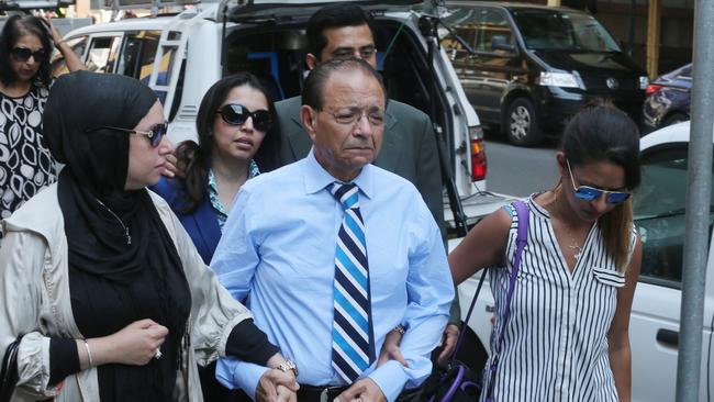 Dr Khalid Qidwai with his children after the Sentencing of Tony Halloun convicted of murdering his wife Shahnaz Qidwai.