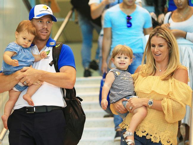 Dave Warner carrying daughter Indie Rae with wife Candice and Ivy Mae.