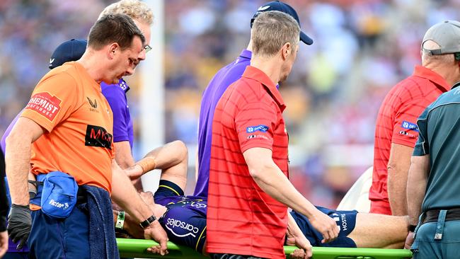 Ryan Papenhuyzen taken from the ground after being knocked out (Photo by Bradley Kanaris/Getty Images)