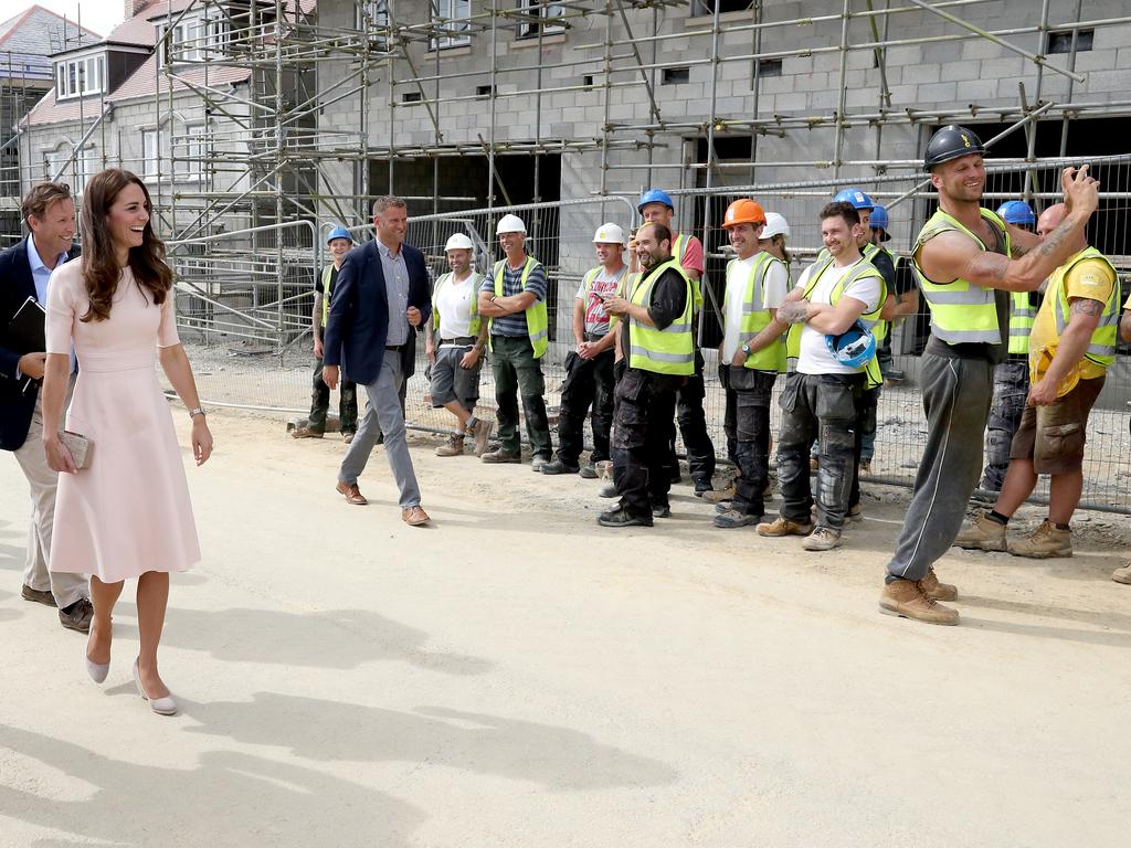 Prince William, Duke of Cambridge and Catherine, Duchess of Cambridge share a joke with construction workers as they visit Nansledan, a 218-hectare site that will provide future business and housing for the local area on September 1, 2016 in Newquay, United Kingdom. Picture: Getty