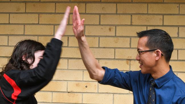 Eddie Woo, leader of maths Growth Program, high fives a student from Richmond River High at a special lab at Southern Cross University. Picture: Cath Piltz