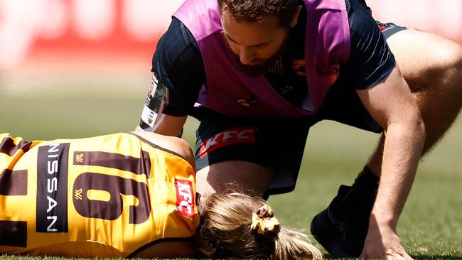 MELBOURNE, AUSTRALIA - NOVEMBER 10: Ainslie Kemp of the Hawks is attended to by trainers during the 2024 AFLW Second Qualifying Final match between the Hawthorn Hawks and the Brisbane Lions at IKON Park on November 10, 2024 in Melbourne, Australia. (Photo by Michael Willson/AFL Photos via Getty Images)