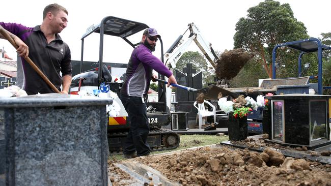 Rookwood Cemetery conducted 2001 interments in 2016-17. Pictured are grave diggers at work.