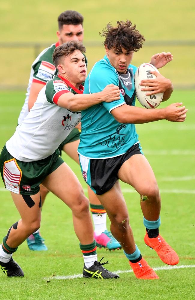 Keanu Wright-Dunrobin bursts through during the QRL Junior State Championships last year.