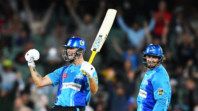 Matt Short celebrates his century and the Strikers’ record-breaking run case. Picture: Mark Brake/Getty Images