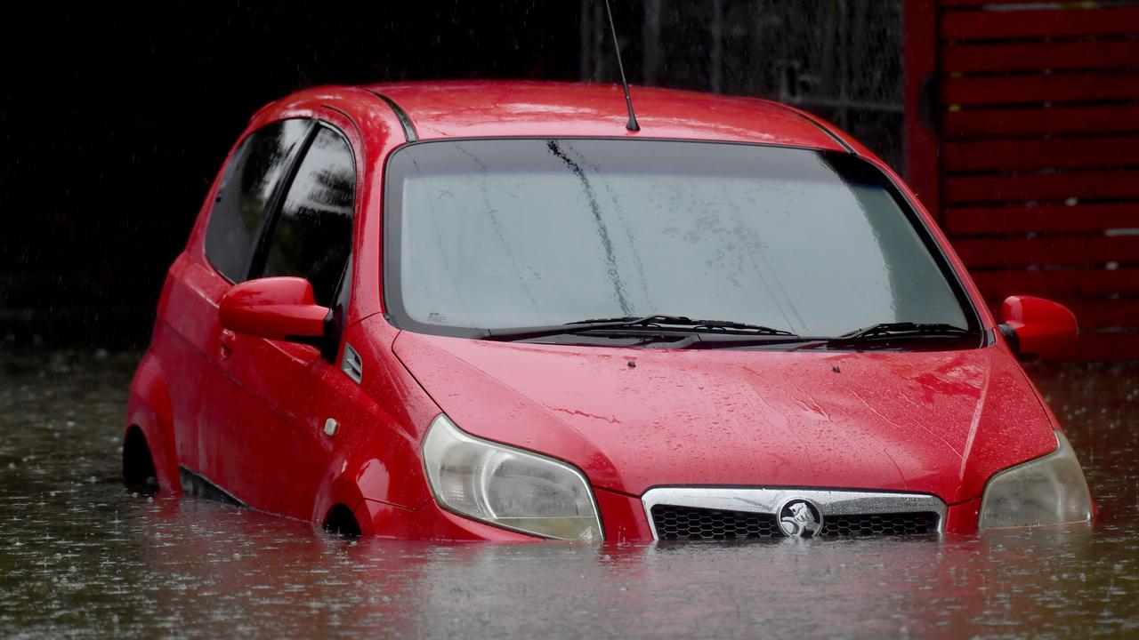 Cars under water in the streets around Northey St at Herston on Saturday morning. Picture, John Gass