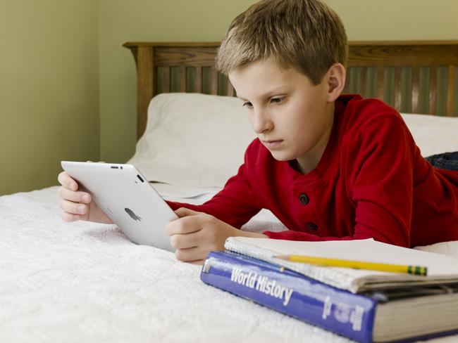 Generic photo of a young boy using a digital tablet   - iPad