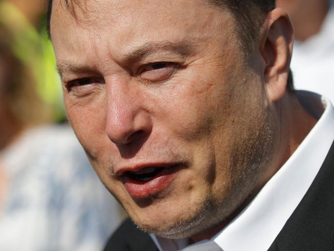 (FILES) In this file photo Tesla CEO Elon Musk talks to media as he arrives to visit the construction site of the future US electric car giant Tesla, on September 3, 2020 in Gruenheide near Berlin. - Whether the topic is transforming the automobile or conquering the next frontier of space, Elon Musk has shown a knack for captivating an audience beyond investors and science geeks. The brash Tesla CEO, now the world's wealthiest person following the electric automaker's meteoric rise, was the quintessential Silicon Valley disruptor -- except he no longer lives in California.On January 7, 2021, Musk surpassed Amazon Chief Executive Jeff Bezos as the world's wealthiest person. (Photo by Odd ANDERSEN / AFP)