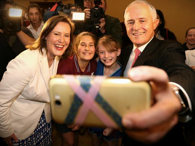 Prime Minister Malcolm Turnbull takes a selfie with Liberal MP for Higgins, Kelly O'Dwyer, during a function for women and girls in sport. Picture: Adam Taylor