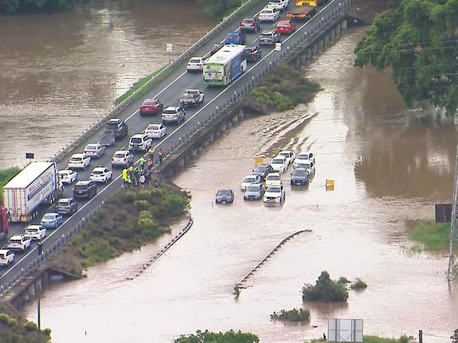 Cars underwater as flash flooding sweeps through Brisbane. Picture: 9 News