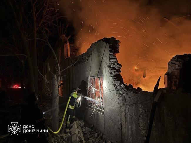 Firefighters put out the fire following a Russian attack in Dobropillya, Donetsk region, Ukraine. Picture: Ukrainian Emergency Service via AP