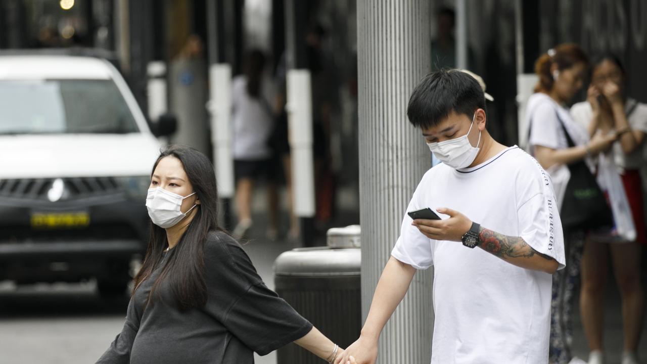 Mask are commonly now being worn around the Sydneys CBD due to the fear of the Coronavirus. Photo: Tim Pascoe