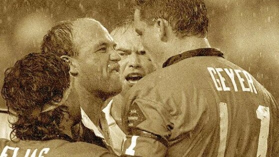 Wally Lewis has a word with Mark Geyer.