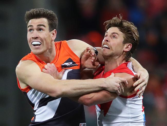 Giants Jeremy Cameron and Sydney's Dane Rampe during the AFL Sydney Derby match between the GWS Giants and Sydney Swans at Spotless Stadium. Picture. Phil Hillyard