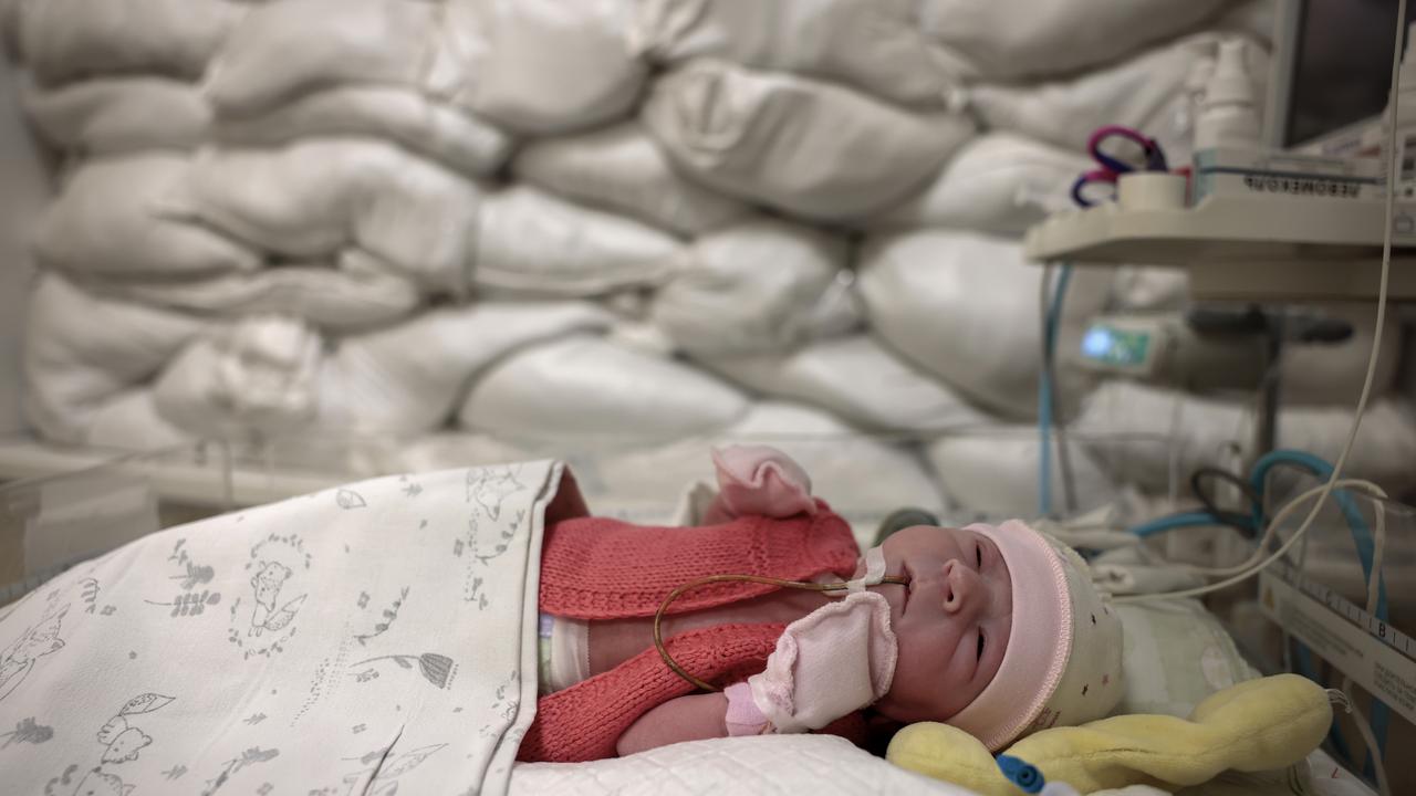 A baby in a cot in front of a window protected by sandbags in the department of intensive care for newborns at Okhmatdyt Hospital, Ukraine. Picture: Jeff J Mitchell/Getty Images