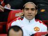 Manchester United's Colombian striker Radamel Falcao smiles on the bench before the English Premier League football match between Manchester United and Hull City at Old Trafford in Manchester, north west England, on November 29, 2014. AFP PHOTO / OLI SCARFF RESTRICTED TO EDITORIAL USE. No use with unauthorized audio, video, data, fixture lists, club/league logos or “live” services. Online in-match use limited to 45 images, no video emulation. No use in betting, games or single club/league/player publications.