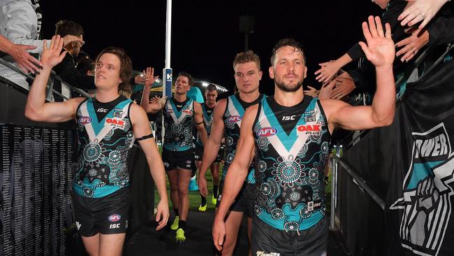 Jared Polec and Travis Boak of the Power walk from the field after the win over Richmond at Adelaide Oval on Friday. Picture: Daniel Kalisz/Getty Images