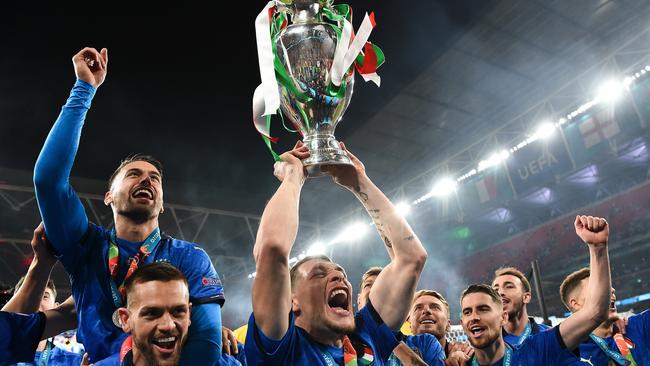 Andrea Belotti of Italy lifts The Henri Delaunay Trophy following his team's victory in the UEFA Euro 2020 Championship Final.