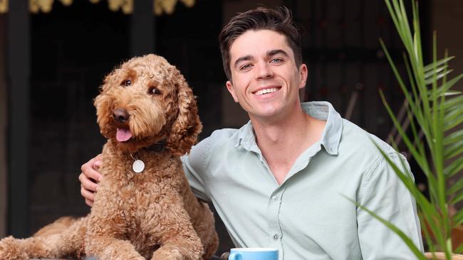 Channel 10 sports presenter and Mix 102.3 breakfast co-host Max Burford at Loveon Cafe, Mile End with his dog Morris. Picture: Russell Millard.