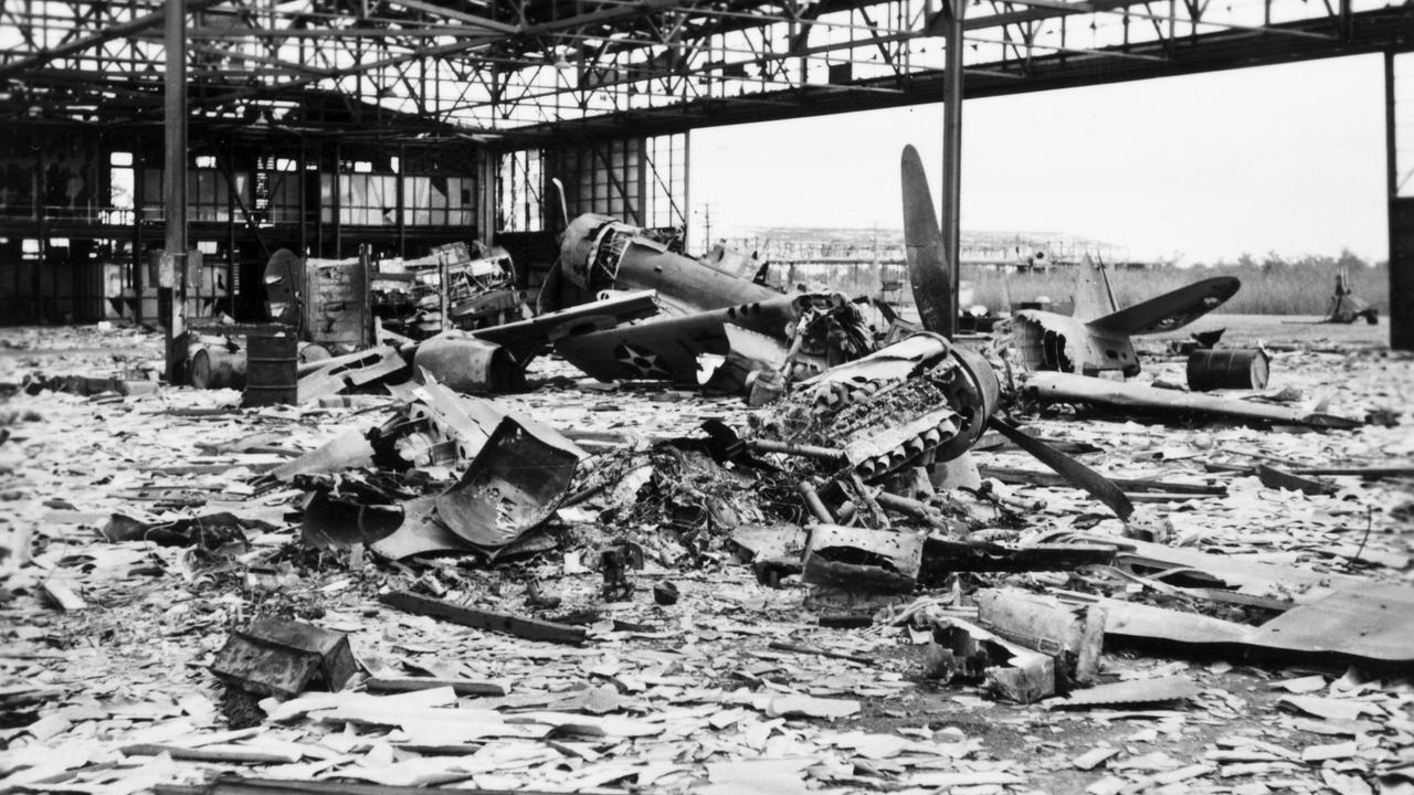 The remains of an Australian Wirrway plane (left) and American Kittyhawk plane (right) in a hanger at the air force base near Darwin after the Japanese bombing on August 19, 1942.