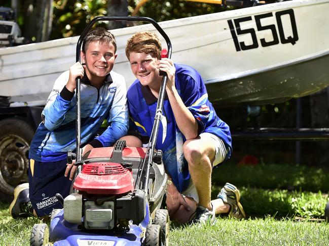 Grade 8 students Daniel McDonald, 13 and Adam Horn, 12 are mowing people's lawns to make cash to buy fishing gear, and have already purchased a boat for $500. PICTURE: MATT TAYLOR.