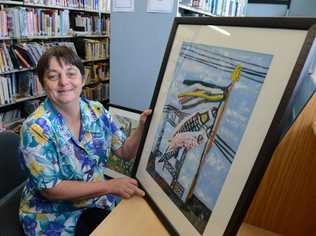 Lismore Librarian Lucy Kinsley with Japanaese prints featuring in the HeART and Peace exhibition. Picture: Cathy Adams