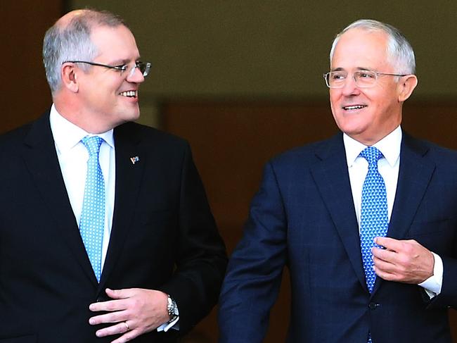 Treasurer Scott Morrison and PM Malcolm Turnbull walking out the front of Parliament House in Canberra to appear on morning TV. Picture Kym Smith