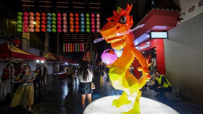 People enjoy Lunar New Year celebrations in Harbour City, Sydney on Friday. Picture: AFP