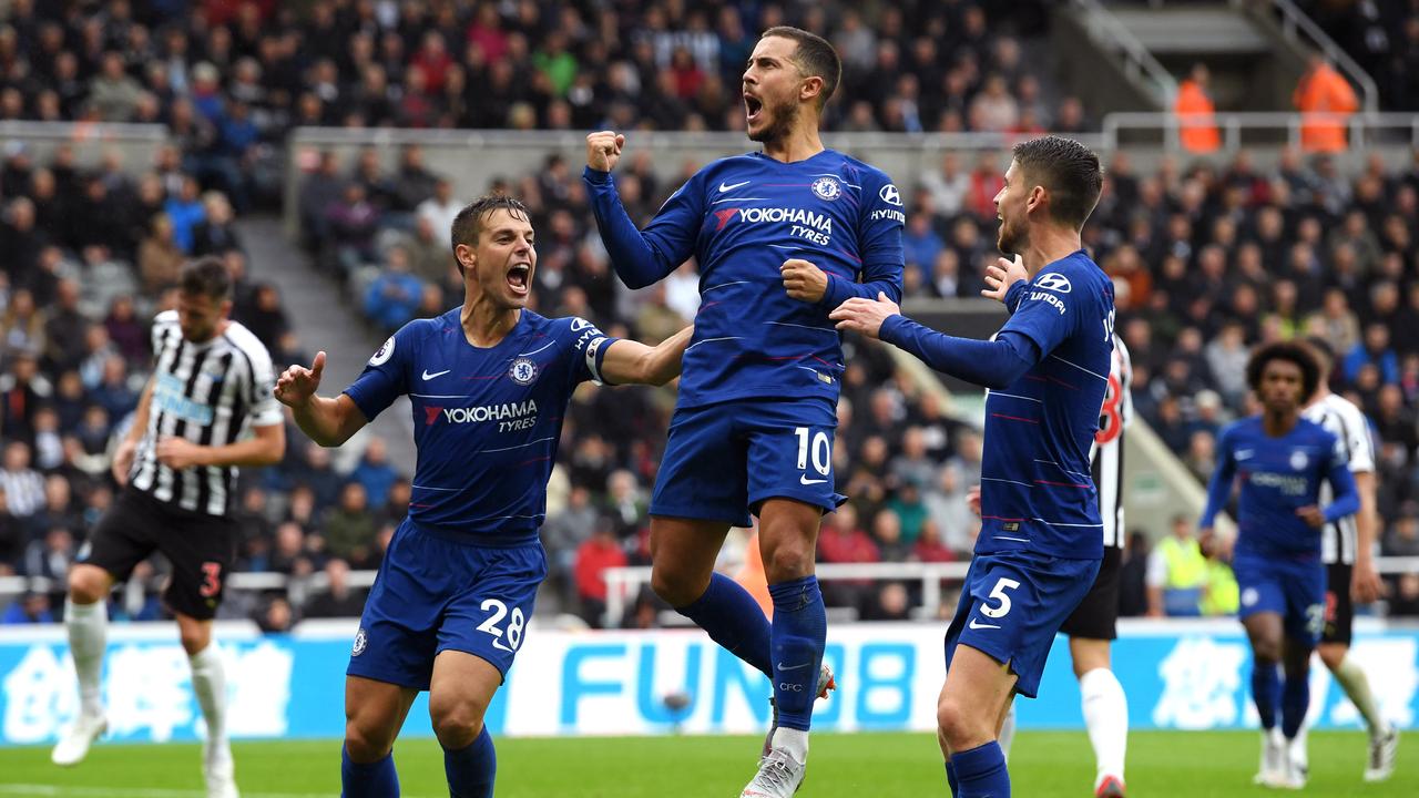 Eden Hazard of Chelsea celebrates with Cesar Azpilicueta and Jorginho after scoring
