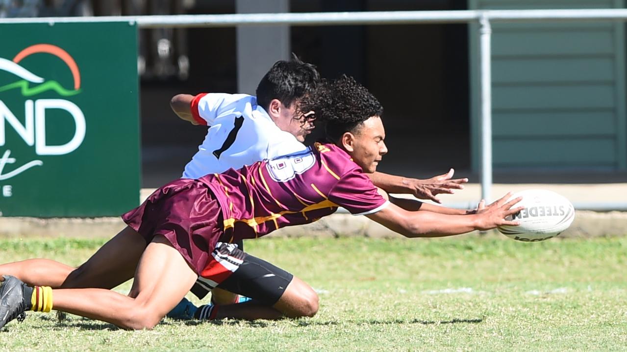 Boys Rugby League State Championship held at Northern Division, Brothers Leagues ground, Townsville. Northwest (maroon) v Wide Bay (white) 14-15 years. Eruweti Gunn-James of Kirwan SHS about to score a try for North West